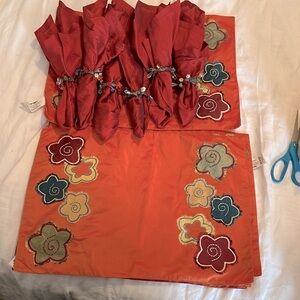 18 total pieces placemats w/napkins and embellished napkin rings.